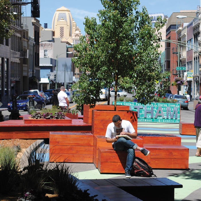 Public space installation at Latham Square Plaza in Oakland with metal and reclaimed wood placemaking elements fabricated by Engineered Artworks in collaboration with Rebar Design Studio.