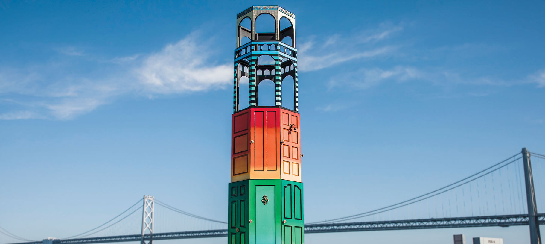 Public art sculpture Welcome Tower fabricated with reclaimed doors and steel by Engineered Artworks at Pier 14 in San Francisco